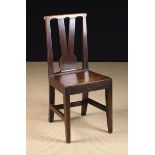 An 18th Century Joined Oak Country Side Chair. The top rail over a V-shaped centre splat.