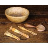 Two Antique Bone Apple Corkers, a treen pastry jigger, lemon juicer, and a treen bowl.