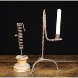 A 17th/18th Century Wrought Iron Rushnip with candle socket 37 cm high (14½").