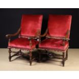 A Pair of 19th Century Carved Walnut Armchairs in the 17th century style.