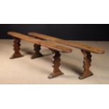 Two Country Benches with long D-ended plank seats on shaped silhouette cut plank supports with