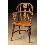 A Low Back Yew-wood Windsor Armchair having a burr-figured back hoop and bow.