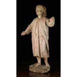 A 17th/18th Century Carved & Polychromed Limewood Figure of the Young Christ Child depicted with