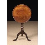 An 18th Century Mahogany Dish-topped Tripod Table.