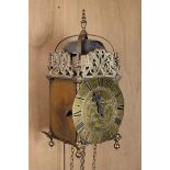 A Brass Lantern Clock; the dial inscribed Tho. Moore Ipswich, 37 cm high (14½").