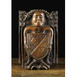 A Late 16th/Early 17th Century Relief Carved Oak Boss/Panel emblazoned with a angel with outswept