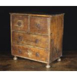 An 18th Century Miniature Painted Chest of Drawers.