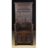 A 19th Century Gothic Style Oak Throne Chair carved with decorative tracery.