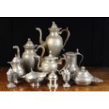A Group of 19th Century Pewter: Two baluster coffee pots and a teapot with animal head spouts,