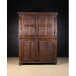 A Fine 16th Century Carved Oak Armoire a deux-corps.