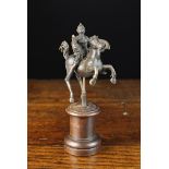 A Small 17th Century Italian Cast Bronze Figure of a Soldier on horseback holding a severed head in
