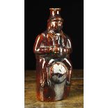 A 19th Century Treacle Glaze Stoneware Bottle moulded in the form of an imbiber wearing a top hat &