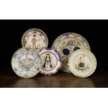 An 18th Century Polychromed Delft Charger with floral decoration 15 cm (13¾") diameter and four