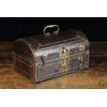 An 18th Century Dome-topped Casket clad in tooled leather with gilt embellishments and fitted with