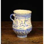 An 18th Century Blue & White Maiolica Mug the frieze painted with a bird flanked by leaping deer,