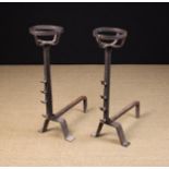 A Pair of 18th Century Wrought Iron Cresset-topped Fire Dogs with spit hooks to the stems,