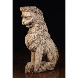 A 16th Century Carved Support in the form of a splendid heraldic lion sejant.