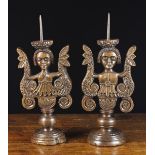 A Pair of Unusual 17th Century Carved Walnut Pricket Candlesticks.