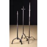 Three 16th century Style Wrought iron Pricket Standards: The tallest with a wrythen stem on an