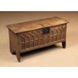 A Small 16th Century Boarded Oak Coffer with Gothic style carving.