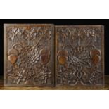 A Fine Pair of 17th Century Carved Oak Panels richly decorated with a stylised flower bloom of