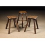 Three 19th Century Country Stools: One having a round turned elm seat and raised on knopped