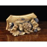 An 18th Century Carved Giltwood Corbel adorned with a rose bloom to the centre flanked by foliage