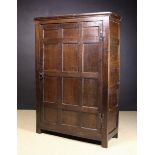 A Late 18th/Early 19th Century Oak Cupboard having a large single door of twelve panels in a