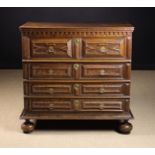 A Charles II Moulded Oak Chest of Drawers enriched with faux mulberry wood-graining to the facade