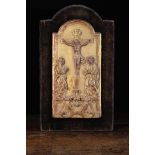 An Early 18th Century Carved & Gilded Arch-topped Tabernacle Door depicting Christ crucified