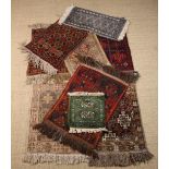 A Group of Nine Small Carpet Mats (late 20th century) The largest 80 cms x 46 cm (31½" x 18"),