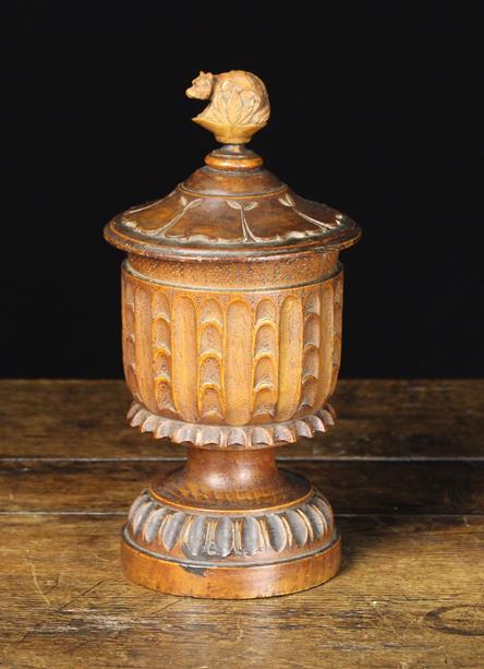 A 19th Century Carved Treen Lidded Tobacco Jar with lead inner lid.