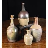 A Group of Four 18th/Early 19th Century French Stoneware Wine-Serving Bottles attributed to the