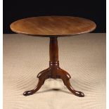 A Tilt Top Tripod Table.