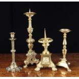 Four Decorative Brass Candlesticks: A Baroque style pricket stick with an elaborate knopped stem &