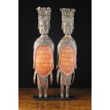 A Pair of Unusual & Quirky Early 18th Century Relief Carved Figures bearing painted cartouches with