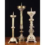 Three Large 19th Century Cast Brass Pricket Candlesticks: One Neo-Gothic with elaborately cast