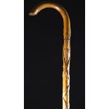 A Carved Folk Art Walking Stick decorated with reptiles with nail-punched markings;