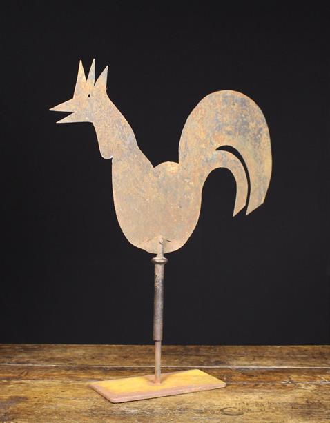 A 19th Century Sheet Iron Weather Vane silhouette cut in the form of a cockerel and revolving on a