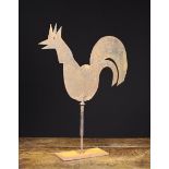 A 19th Century Sheet Iron Weather Vane silhouette cut in the form of a cockerel and revolving on a
