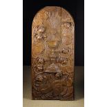 A Flemish Baroque Relief Carved Oak Arch-topped Ecclesial Cupboard Door,