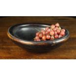 A 19th Century Treen Bowl with residual black patination, 36 cm in diameter (14").