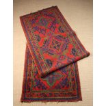 A Vintage Turkish Red Ground Wool Runner 350 cms x 95 cm (138" x 37½").