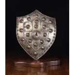 A Reproduction Steel Swiss-shaped Shield with a cruciform centre panel outlined in ropetwist,