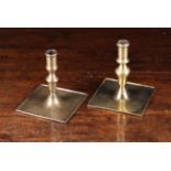 Two Similar 17th century Spanish Candlesticks with knopped stems screwing into flat square bases