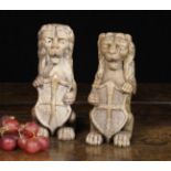 A Pair of Small Oak Heraldic Lions Sejant Erect, late 17th/early 18th Century.