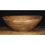 A Large, Shallow Dug Out & Turned Oak Bowl with slightly raised foot, 3 in (8 cm) high,