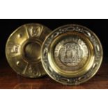Two Repoussé Brass Alms Dishes: A 16th century Nuremberg style dish embossed with The Spys of