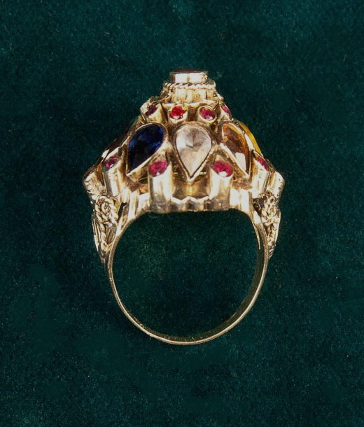 An 18th Carat Yellow Gold Marharja Ring set with Rubies, and teardrop petals of rubies, sapphire, - Image 2 of 4