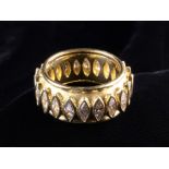 An 18 Carat Yellow Gold & Diamond Band Ring.